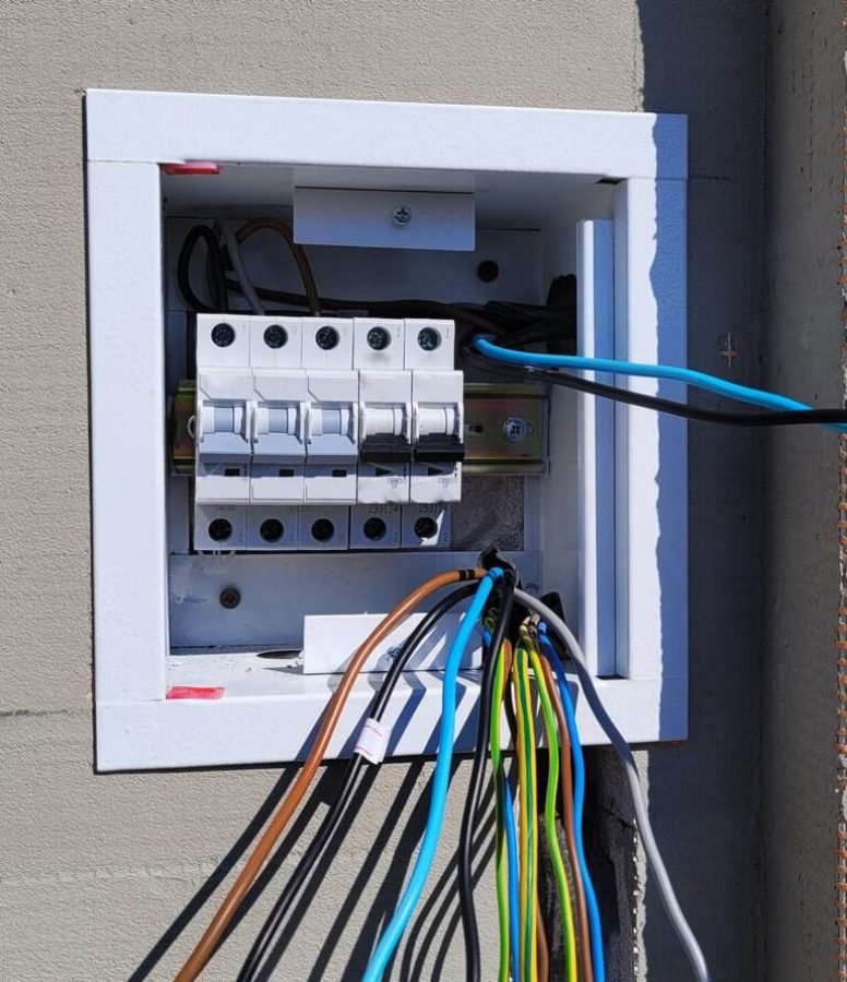 Electrical control panel with wiring for automation systems installation.